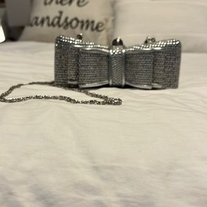 Silver sequin clutch bag.